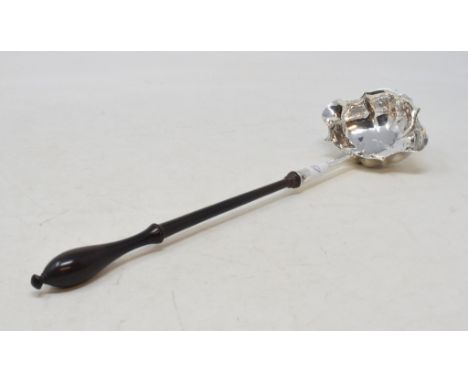 A George III silver toddy ladle, initialled, with a lignum vitae handle, marks rubbed, a pair of plated on copper wine coaste