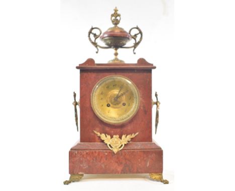 A late 19th century mantel clock, the 8.5 cm brass dial with Arabic numerals, fitted an eight day movement, in a red marble a