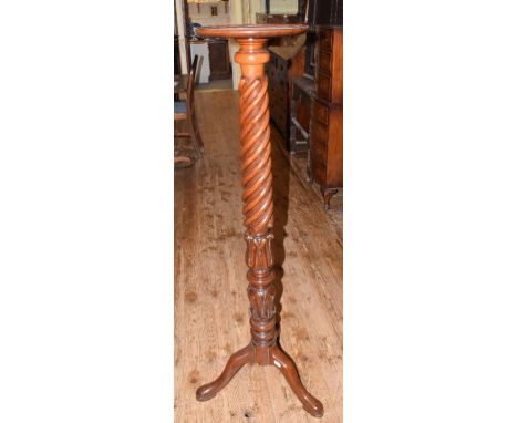 A Victorian mahogany torchere, with a rope twist and lotus leaf carved column, on a tripod base 