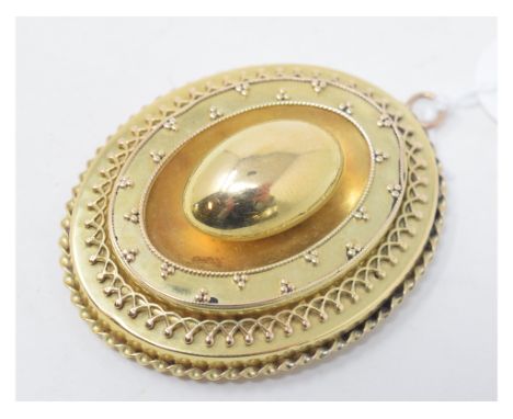 A late Victorian oval target type pendantLater ring attachment, with a hole to the back. 