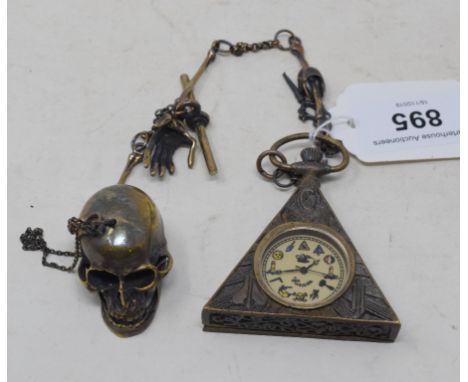 A brass masonic style watch, on a skull chainReport by GHModern reproduction piece.Watch seems to run for a bit and adjusts.D