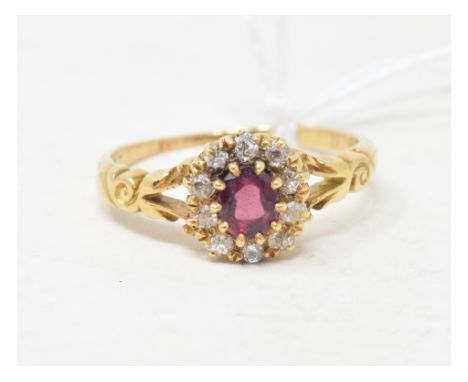 An 18ct gold, ruby and diamond cluster ring, approx. ring size PApprox. 3.4 g 