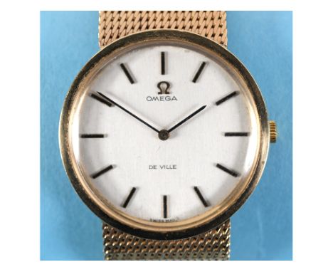 A gentleman's 9ct gold Omega De Ville wristwatch, the silvered dial with baton indices, on a 9ct gold mesh strap, with box an