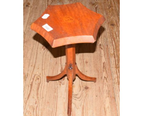 A 19th century inlaid satinwood candle stand, with a curving octagonal top, on splayed tripod legs, 23 cm wide 
