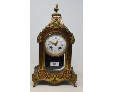 A late 19th century French mantel clock, the 9 cm diameter enamel dial with Roman numerals, fitted an eight day movement, in 