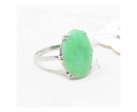 An Art Deco platinum and jade ring 