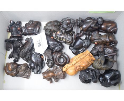 A Japanese carved wood netsuke, in the form of a skeleton, and others similar 