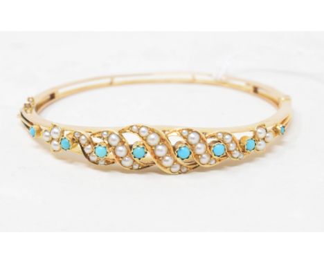 An Edwardian bangle, set seed pearls and turquoise 