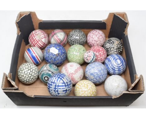 Eighteen Scottish pottery carpet bowls, variously decorated, including a jack, 8 cm diameterReport by GHThe carpet bowls - al
