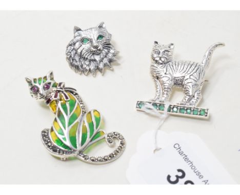 Three silver, ruby and emerald set cat brooches 