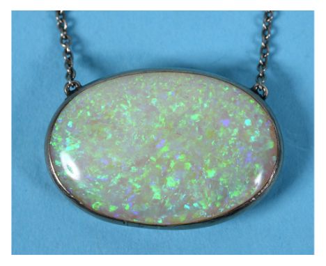 An Edwardian oval opal pendant, on a white metal chain  See illustration 