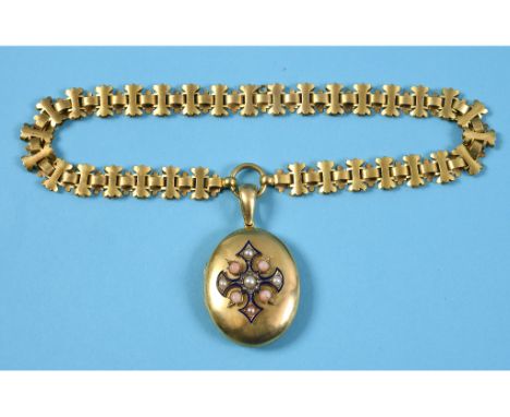 A Victorian oval locket, set a cross with blue enamel, seed pearls, diamonds and coral, on a gothic style chain See illustrat