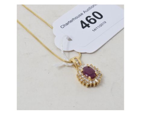 An 18ct gold, ruby and diamond pendant, on a chain 
