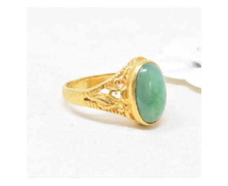 A Chinese yellow coloured metal and jade ring, approx. ring size K 