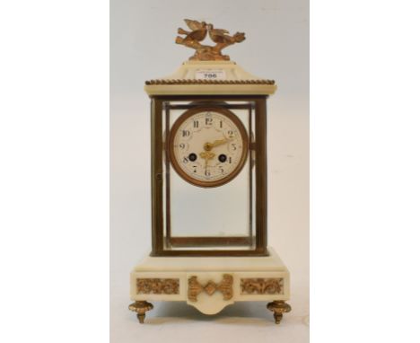 A late 19th century mantel clock, the 8 cm diameter enamel dial with Arabic numerals and floral swags, fitted an eight day mo