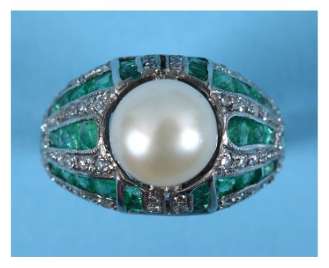 An Art Deco style white coloured metal pearl, emerald and diamond ring, approx. ring size N  See colour illustrationReport by