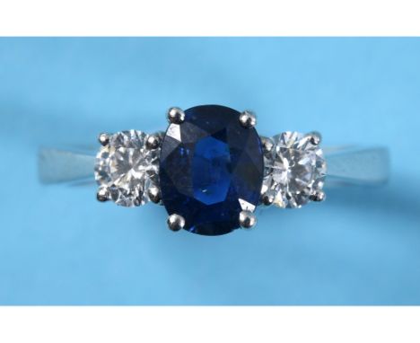 An 18ct white gold sapphire and diamond three stone ring, approx. ring size M See illustration 