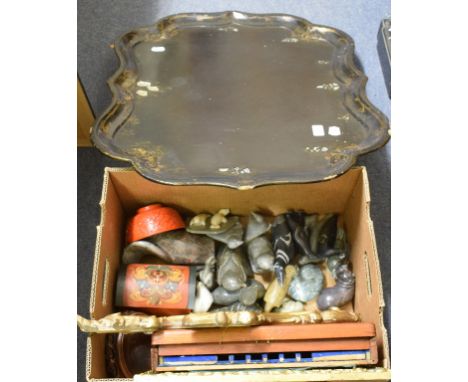 A collection of Canadian Inuit stone carvings, two mirrors, a papier mache tray and other items (qty)Report Most carvings hav