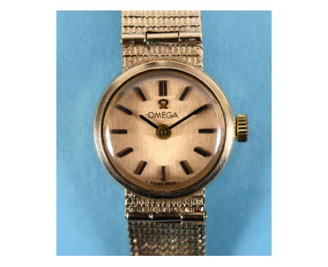 A lady's 9ct gold Omega wristwatch, with baton indices and a mesh strap, with box  See illustrationReportWeight - 19.9 g 