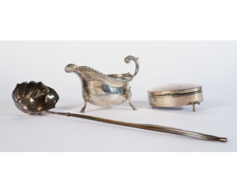 A SILVER SAUCEBOAT AND TWO FURTHER ITEMS (3)The sauceboat with a scrolled handle, gadrooned rim and raised on three pad feet 