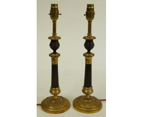 A PAIR OF FRENCH RESTAURATION STYLE GILT BRONZE TABLE LAMPS (2)Late 20th CenturyWith fluted tapering columns, on bases cast w