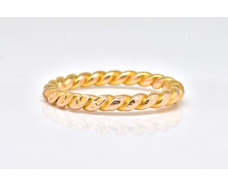 A FRENCH GOLD OVAL HINGED BANGLEOf ropetwist form, on a snap clasp, fitted with a safety chain, gross weight 20.6 gms, with a