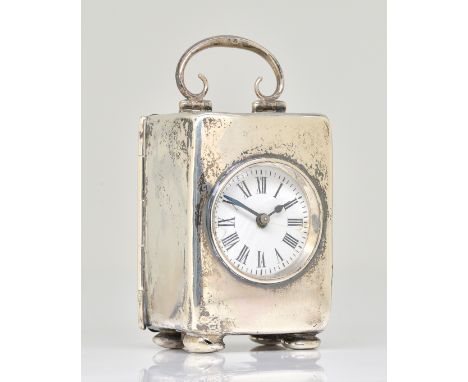 A SILVER CASED RECTANGULAR SMALL CARRIAGE CLOCK TIMEPIECEThe circular enamelled dial with black Roman numerals and with blued