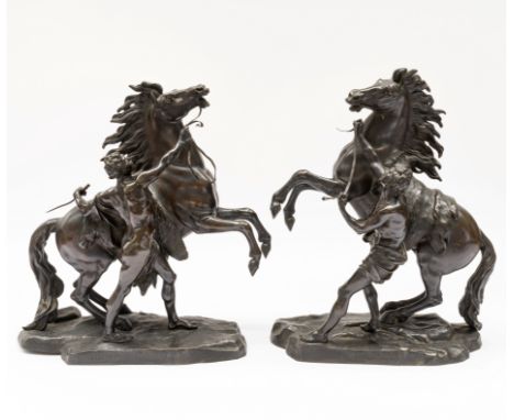 AFTER GUILLAUME COUSTOU THE ELDER (1677-1746);  A PAIR OF BRONZE MODELS OF THE MARLY HORSES (2)Early 20th CenturyThe larger, 