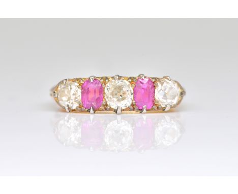 AN 18CT GOLD, RUBY AND DIAMOND FIVE STONE RINGClaw set with three cushion shaped diamonds alternating with two cushion shaped