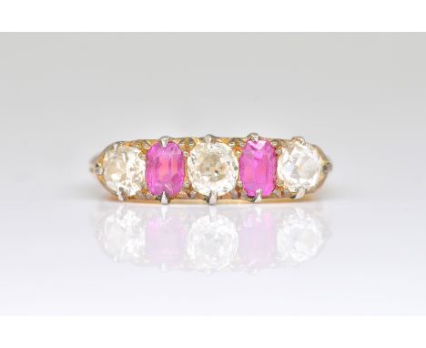 AN 18CT GOLD, RUBY AND DIAMOND FIVE STONE RINGClaw set with three cushion shaped diamonds alternating with two cushion shaped