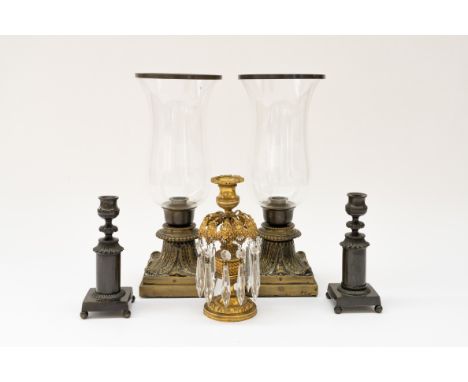 A PAIR OF REGENCY PATINATED BRASS CANDLESTICKS TOGETHER WITH A REGENCY GILT-BRASS AND LUSTRE MOUNTED CANDLESTICK (5)Early 19t
