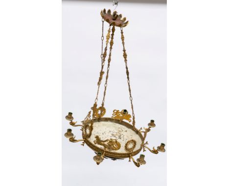 AN EMPIRE REVIVAL GILT AND PATINATED BRONZE EIGHT-LIGHT CHANDELIERLate 19th CenturyThe dished base mounted with laurel wreath