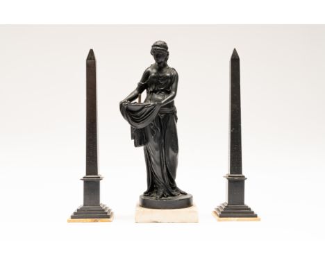 A PAIR OF FRENCH BLACK MARBLE OBELISKS AND A CLASSICAL MAIDEN (3)19th CenturyIncised with hieroglyphs, on Siena marble bases,