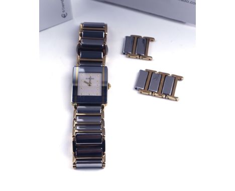 RADO: A LADY'S TITANIUM AND GILT METAL DIASTAR BRACELET WRISTWATCHCirca 2005, the signed rectangular silvered dial with gilt 