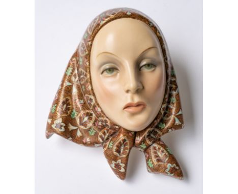 A LENCI `TESTA'  WALL MASKDated 1938modelled by Helen König Scavini, as the head of a young woman wearing a headscarf, paper 
