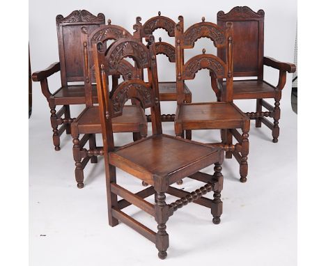 A SET OF SIX CHARLES II STYLE OAK FRAMED BOBBIN TURNED DINING CHAIRS (6)Including a pair of carvers