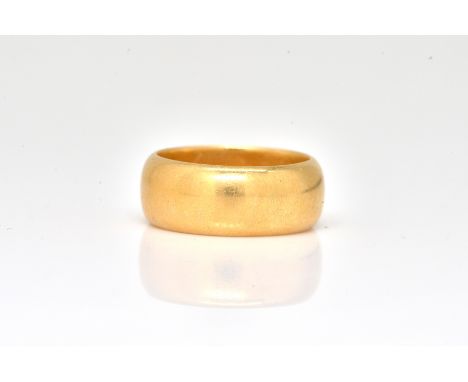 A LATE VICTORIAN 18CT GOLD WEDDING RINGThe un-decorated plain wide band ring initial engraved within G R, Birmingham 1898, ri