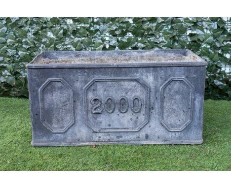 A MILLENNIUM CELEBRATION RECTANGULAR LEAD GARDEN PLANTER81cm wide; 41cm deep; 40cm high