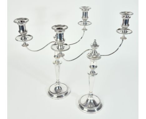 A PAIR OF PLATED ON COPPER TWIN LIGHT TABLE CANDELABRAWith detachable arms, decorated with gadrooned rims and raised on circu