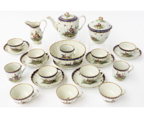 A WORCESTER PORCELAIN PART TEA AND COFFEE SERVICE (25)1780'sOf fluted form, painted with birds in landscapes inside cobalt-bl