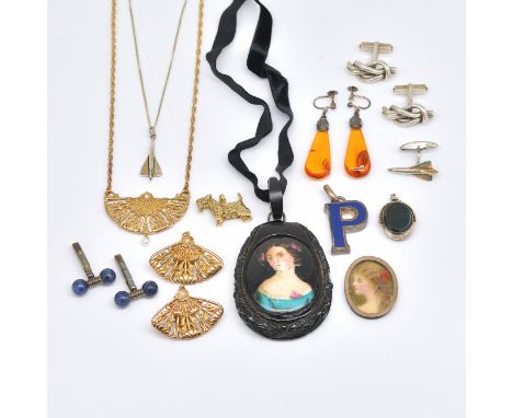 A COLLECTION OF JEWELLERY (11)Comprising; a Victorian drop shaped jet pendant, fitted with a portrait of a lady, a pair of St