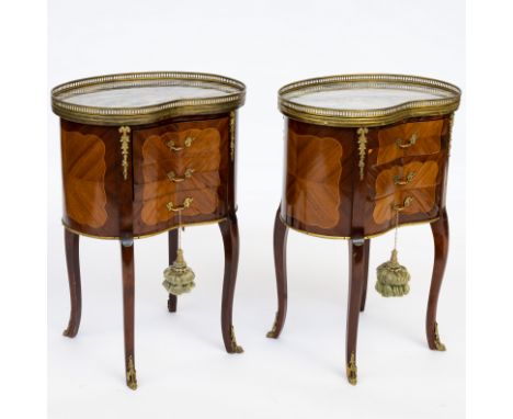 A PAIR OF 18TH CENTURY STYLE FRENCH MARBLE AND GILT-METAL MOUNTED KIDNEY SHAPED THREE DRAWER BEDSIDE TABLES (2)52cm wide; 35c