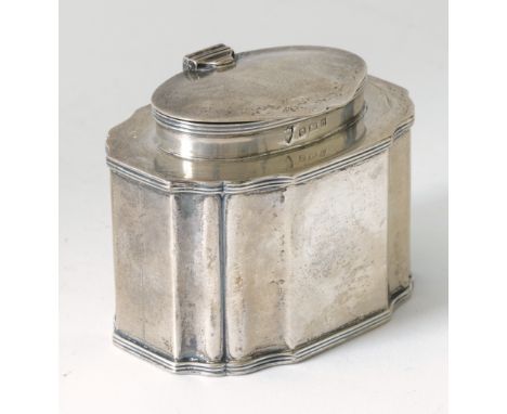 A SILVER HINGE LIDDED TEA CADDYOf shaped rectangular form, having an oval top, decorated with reeded borders, Birmingham 1907