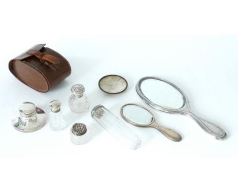 A GROUP OF MOSTLY SILVER MOUNTED WARES (9)Comprising; four silver topped, faceted glass toilet bottles and jars, a pair of si