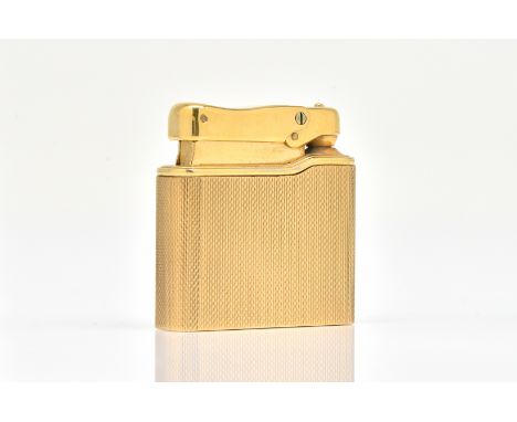 A 9CT GOLD CASED COLIBRI LIGHTEROf curved rectangular form, with engine turned decoration, detailed Colibri Minigas England, 