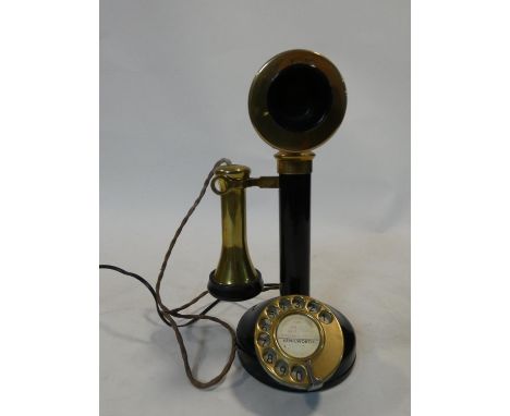 An early 20th century enamel on brass and Bakelite candlestick telephone, rewired. Stamped W.30 H.30cm 