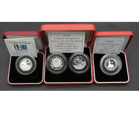 Four Royal Mint piedfort silver proof 50 pence coins. Including a UK 150 years Public Library silver proof Piedfort 50p coin 