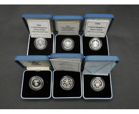 Six Royal Mint one pound silver proof coins. All in pale blue presentation cases, including 1999, 1988, 1993 and 1994, four h