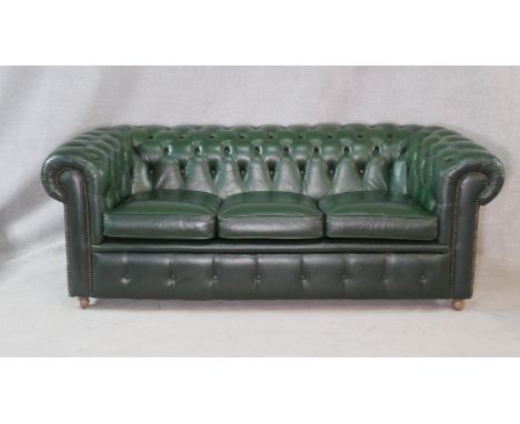 A three seater Chesterfield sofa in deep buttoned upholstery. H.70 W.200 D.92cm 