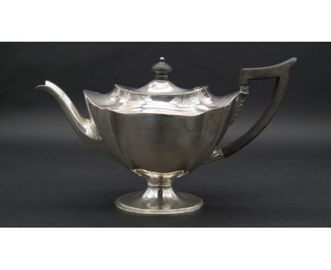 A Victorian silver tea pot with ebony handle and finial with scalloped design. Hallmarked: TB for Thomas Bradbury &amp; Sons,